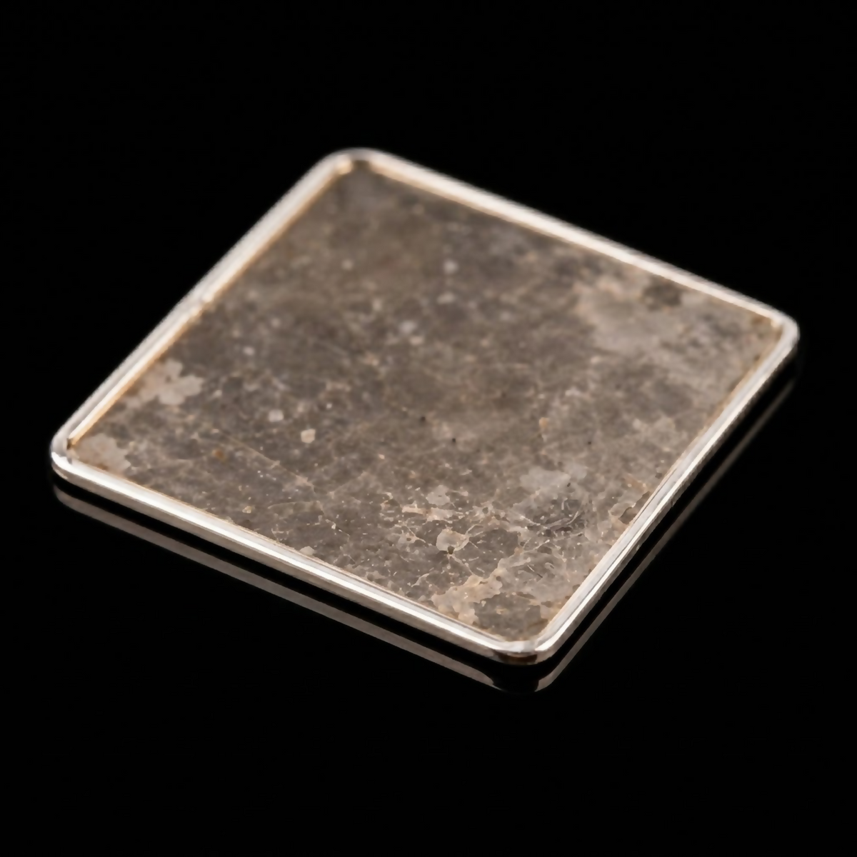 Japanese 20 mm square mica incense heating plate with thin silver border and natural mineral surface against a black studio background