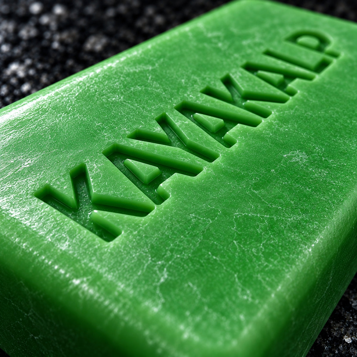 Sacred Plants Australia Kayakalp Ayurvedic coconut oil soap, ultra-macro low-angle close-up of recessed KAYAKALP letters on green bar