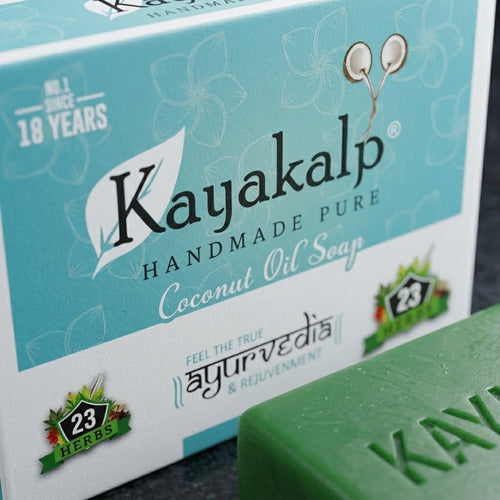 Sacred Plants Australia Kayakalp Ayurvedic coconut oil soap with 23 herbs, close-up of turquoise retail box and embossed green soap bar.