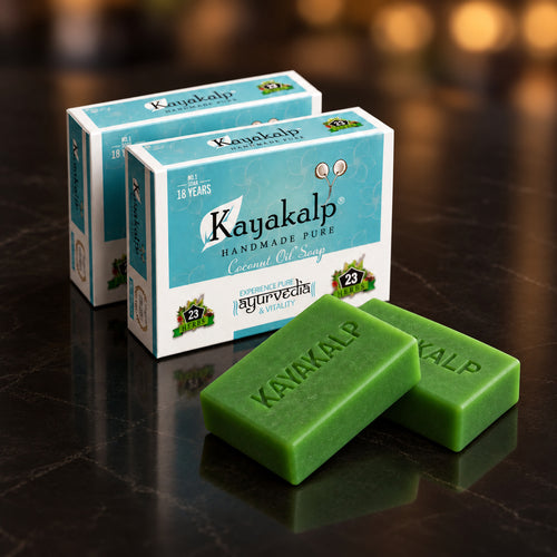 Kayakalp Ayurvedic bath soap with two identically sized green bars and two original retail boxes on dark polished stone