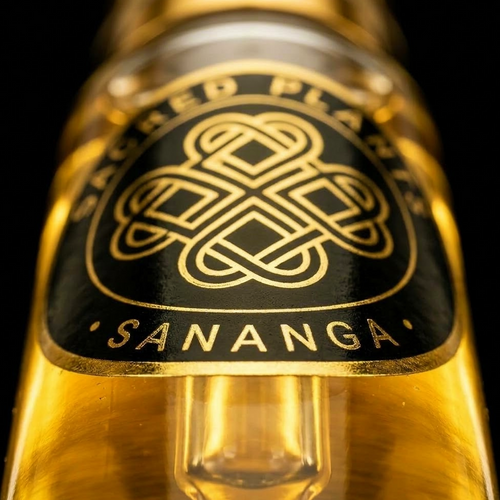 Extreme macro of gold Sacred Plants Australia SANANGA emblem on glass botanical extract bottle