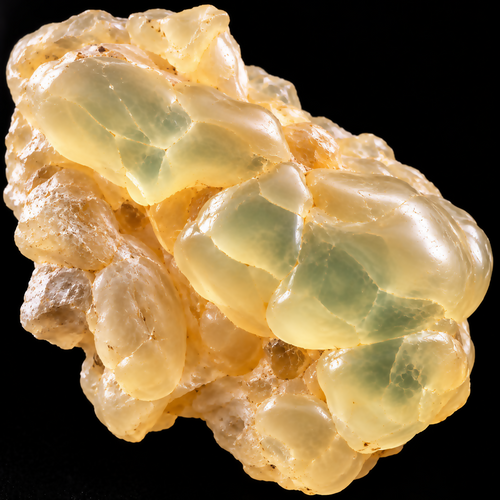 Dhofar Royal Hojari Frankincense Hydrosol | Boswellia sacra – top-down macro of a translucent ivory, champagne and pale green frankincense resin specimen on black